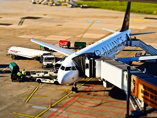 Aircraft at the airport gate being refuelled